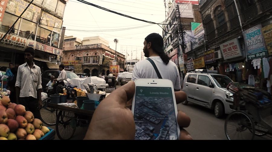 Navigating a crowded Indian bazaar on foot, phone map in hand